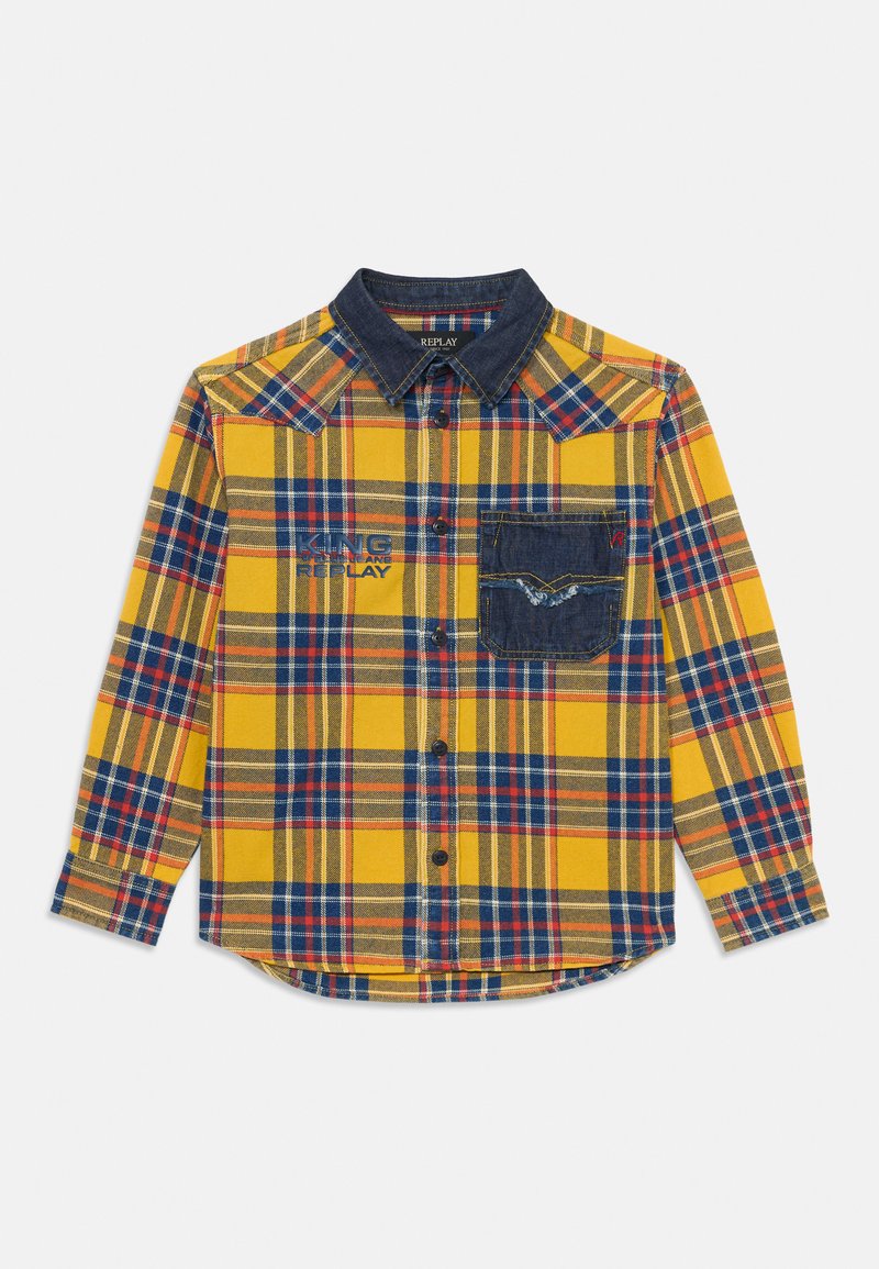 Żółta koszula w kratę z niebieskimi i czerwonymi wzorami, denimowa kieszeń, zapięcia na guziki i spiczasty kołnierzyk. Posiada logo na piersi.