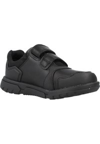 Basket noir de sport avec tige en synthétique, accents en maille, sangles Velcro et semelle en caoutchouc texturée avec motifs de traction.