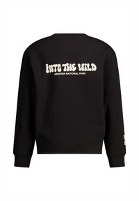 Mustapaita, jossa selässä on valkoisilla, paksuilla ja pyöreillä kirjaimilla tekstit "INTO THE WILD" ja "ARIZONA NATIONAL PARK". Normaali malli, jossa on neeropitsit hihansuissa.