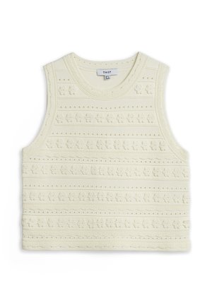 Top smanicato lavorato a maglia di colore crema con scollo rotondo e file orizzontali di piccoli motivi floreali e puntini in rilievo.