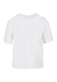 T-shirt en coton blanc avec des manches courtes, un col rond et une coupe décontractée. Le dos est lisse, sans motifs ni designs.