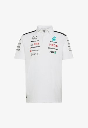 White polo shirt with a collar, featuring black shoulder stripes and various logos in black, red, and turquoise on the front and sleeves.