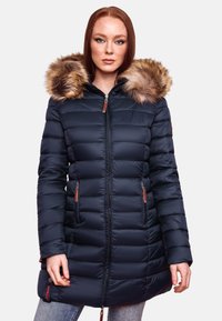Navy blue padded coat with faux fur hood, zippered pockets, and detailed seams. Features a waist-length design and a small logo on the hem.