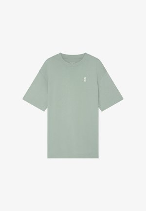 Maglietta verde chiaro a maniche corte con scollo rotondo e piccolo logo bianco "on" sul petto a sinistra, design semplice.