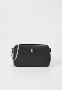 Black textured faux leather clutch with silver hardware, zipper closure, and detachable silver chain strap. Features embossed logo detail.