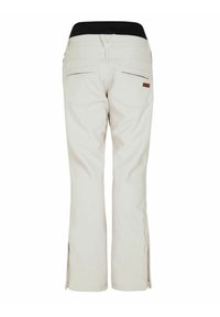 Beige geïsoleerde broek met een zwarte tailleband, voorzien van twee achterzakken en ritsen aan de onderkant voor een verstelbare pasvorm.