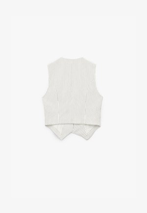 Biała bezrękawnik z pionowymi czarnymi paskami, z wysokim dekoltem i zakończeniem w kształcie szpicu z tyłu. Gładka faktura materiału, dopasowany krój.