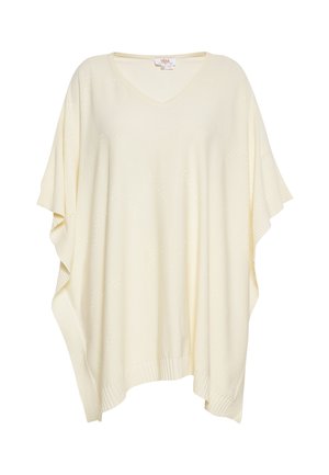 Krémfarvet poncho-sweater med V-hals, løs pasform, ribbede kanter og subtile stjerneformede hulmønstre. Blød striktekstur.