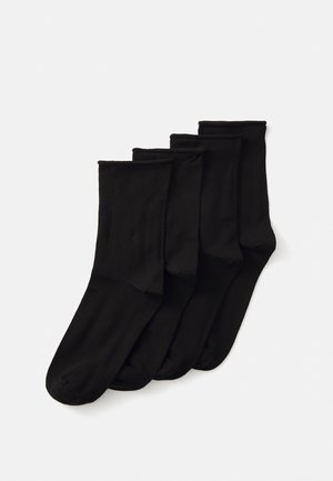 Schwarze Baumwollsocken, Set aus vier, wadenlang, glatte Textur, einfarbig, ohne Muster oder zusätzliche Hardware.