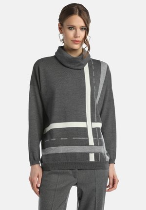 Gray oversized sweater with a cowl neck, featuring geometric white and light gray patterns. Soft texture, wide sleeves, and ribbed cuffs.