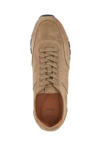 Beige suede sneaker with rounded toe, lace-up design, and textured surface. Features a tan leather lining and black rubber outsole.