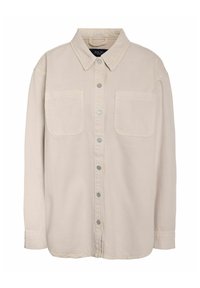 Bézs színű, gombos ing gallérral, két első zsebbel és hosszú ujjakkal. Puha, texturált anyagból készült, fémes gombokkal.