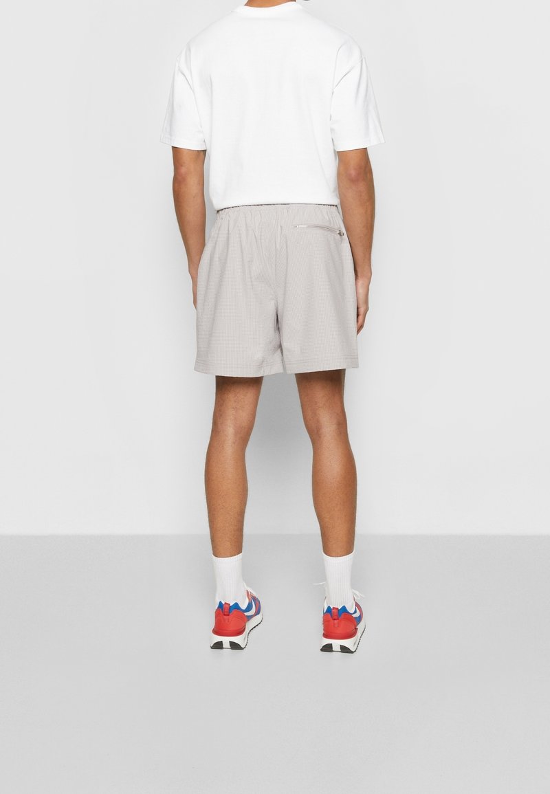 Nike Sportswear Pantaloni sportivi light grey/grigio chiaro