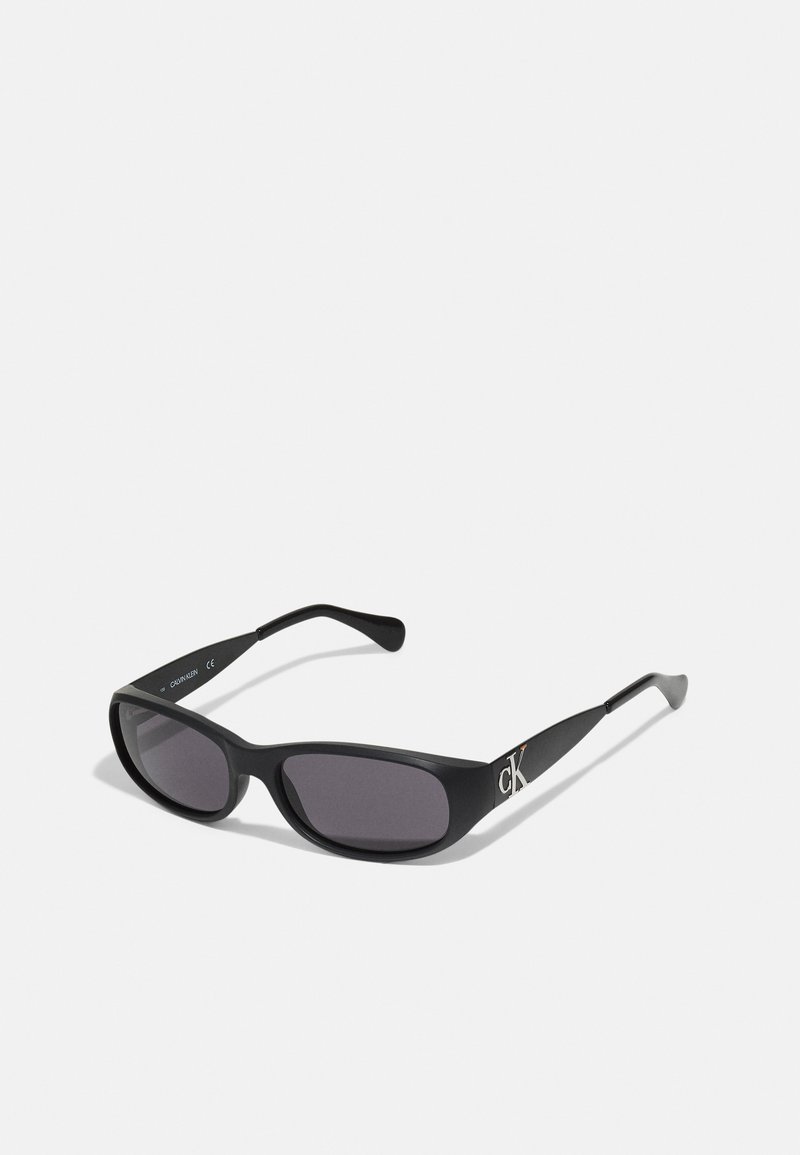 Calvin Klein HERON PRESTON UNISEX - Óculos de sol - black