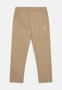 Knee-length beige pants with an elastic waistband, side pockets, and a small white logo on the left leg. Made from soft, durable fabric.