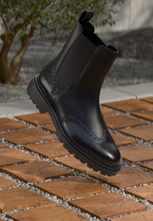 IVYHILL - Kotníkové boty na platformě - black