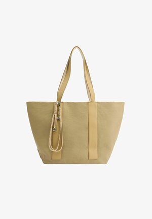 Beige Canvas-Shopper-Tasche mit zwei Ledergriffen, einem Reißverschluss und einem dekorativen Kordelzug. Verfügt über eine strukturierte, schräge Form.