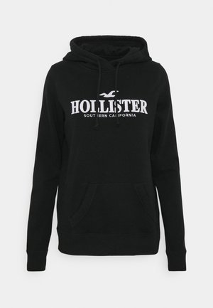 Mustast puuvillasegust kapuutsiga dressipluus, millel on kenguru tasku, nöörist kapuuts ning valge "Hollister" logo ja "Southern California" tekst.