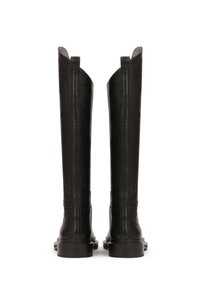 Bottes en cuir noir montantes avec un design épuré, une texture lisse et des semelles plates. Présente deux petites boucles en haut pour faciliter l'enfilage.