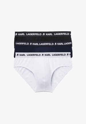 Tre slip da uomo in nero, blu navy e bianco, ciascuno con una fascia elastica brandizzata con la ripetizione di "KARL LAGERFELD" e un logo a silhouette.