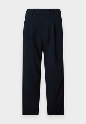 Pantalon bleu marine en tissu lisse, avec une taille ajustée à élastique et des jambes effilées avec des poignets élastiques aux chevilles.