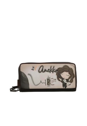 Rechteckige beige Geldbörse mit dunkelbraunem Rand, Cartoon-Mädchen mit geschlossenen Augen und dem Text "Anekke" und "Vibe with sound" auf der Vorderseite.