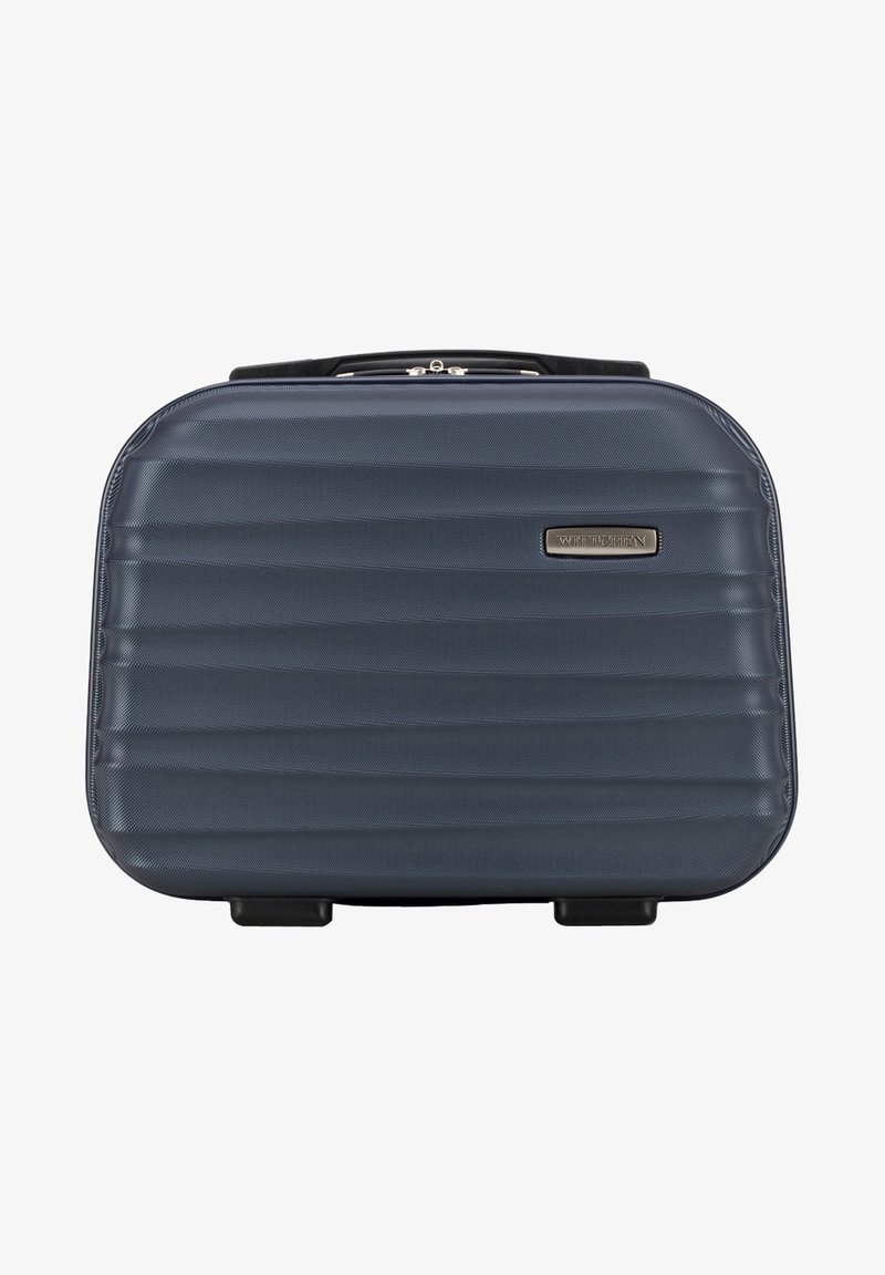 Valigia rigida di colore blu scuro, caratterizzata da un design rigato, superficie testurizzata e una maniglia robusta. Include quattro ruote nere per la mobilità.