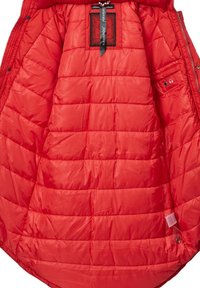 Red puffer jacket interior with quilted texture, featuring a black label and a small pocket with a headphone port. Smooth, shiny material.