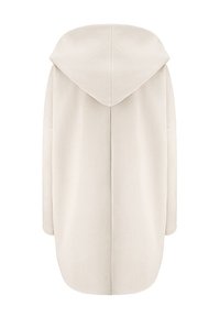 Jasno beżowy oversize'owy hoodie o gładkiej fakturze, z dużym kapturem i obniżonymi szwami ramion. Posiada prosty dół i minimalistyczny design.