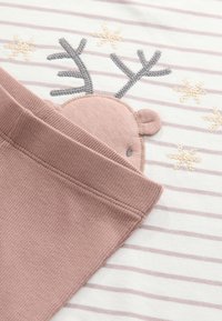 Beige and mauve striped fabric featuring an embroidered reindeer with antlers and snowflake accents; soft texture, ribbed cuffs.