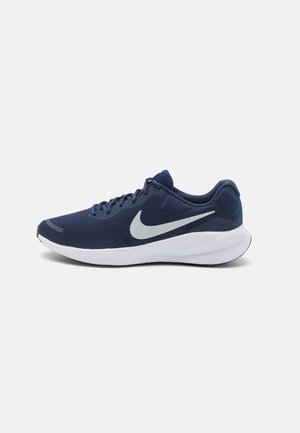 Scarpa da corsa Nike in rete blu scuro con accenti grigi, caratterizzata da una punta arrotondata, suola bianca piatta e design con lacci.