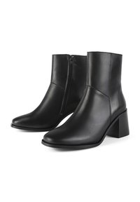 Black leather ankle boots with a sleek design, pointed toe, side zipper, and block heel. Smooth texture with minimal detailing.