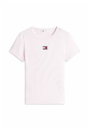 Light pink short-sleeve ribbed cotton T-shirt with round neckline and small Tommy Jeans logo patch centered on the chest.