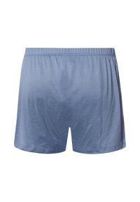 Blå bomullsshorts med elastisk midja. Slät textur, lös passform och inga mönster. Viddslutningar avslutade med en rak söm.