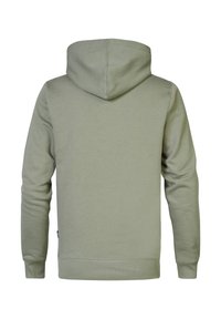 Sudadera con capucha de color verde claro, con mangas largas, costuras visibles y puños y dobladillo acanalados, mostrada desde atrás sobre un fondo blanco.