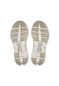 Semelles de chaussures de course en gris clair et blanc cassé, avec un motif de grip texturé, un design segmenté et un logo Cloudtec visible.