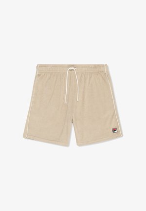 Shorts en éponge beige avec taille élastique, cordon blanc, liseré blanc sur le côté, et petite étiquette logo Fila sur l'ourlet de la jambe gauche.