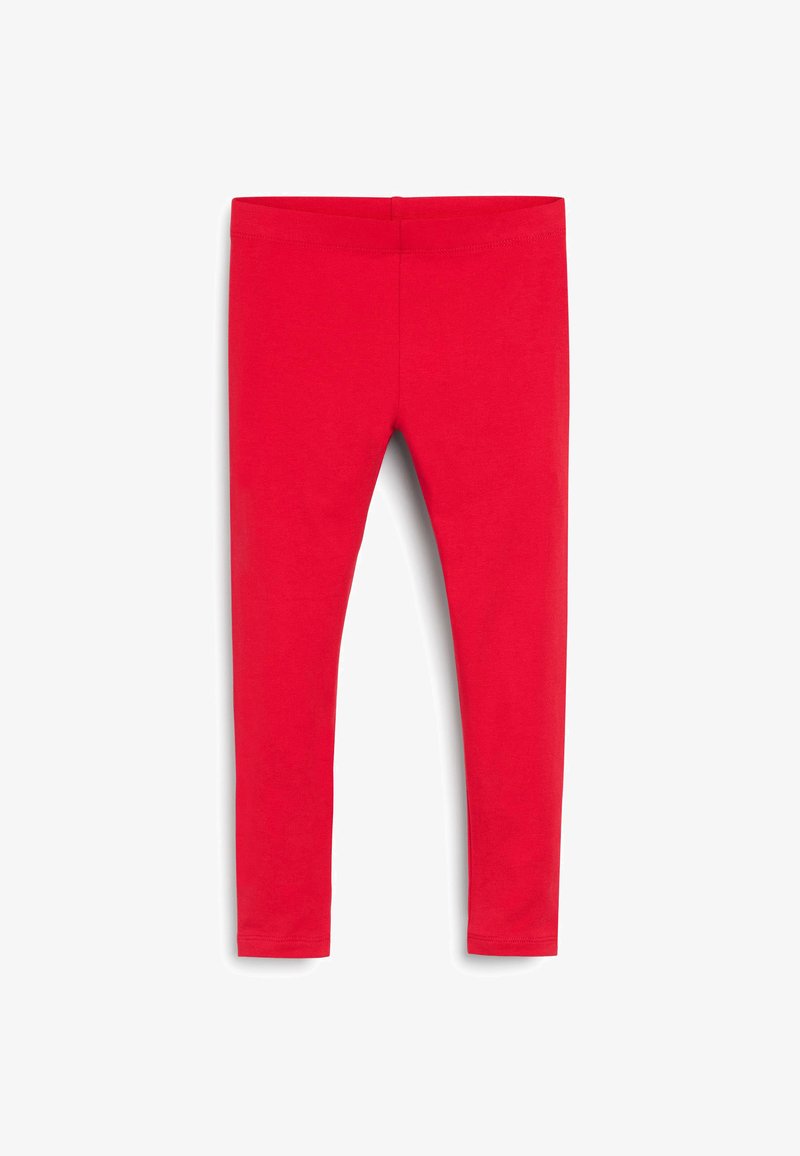 Piros leggings rugalmas anyagból, sima textúrával és elasztikus derékrésszel, a bokánál szűkülve, és nincs észlelhető mintázata.
