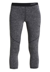 Szare legginsy sportowe wykonane z fakturowanej tkaniny, z czarnym pasem w talii z logo oraz dopasowanymi szwami podkreślającymi sylwetkę.