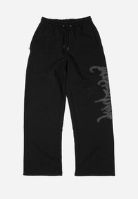 NETHER UNISEX - Tracksuit bottoms - black