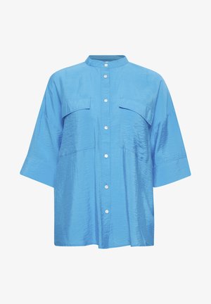 Camicia blu a maniche corte con colletto alla coreana, due tasche sul petto, chiusura frontale con bottoni e una finitura in tessuto leggermente lucido e strutturato.