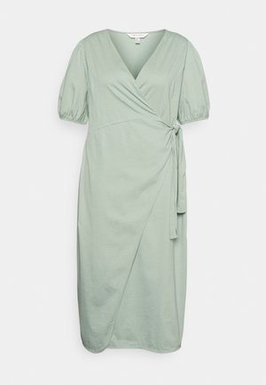 Vestido envolvente verde menta com mangas curtas bufantes, decote em V e um detalhe de laço na cintura. Feito de um tecido leve e suave.