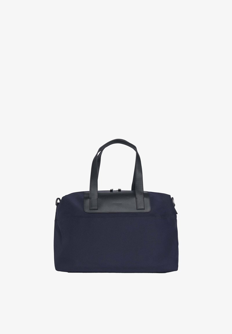 Merenkappinen kangaskassi mustilla nahkakoristeilla, jossa on kaksi ylhäältä tarttumiskahvaa ja vetoketjusuljenta, yksinkertainen ja rakenteellinen muotoilu.