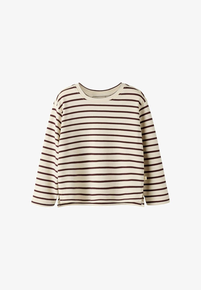 Kerman pituza zrakava dolgi rokavi s rjavimi vodoravnimi črtami. Ima okroglo ovratnik in stranske reže na robu za dodatno gibljivost. Mehka tekstura blaga.