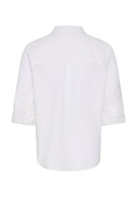 Vue arrière d'une chemise blanche unie à manches courtes avec un col et un pli central sur le haut du dos.