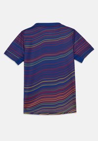 Short-sleeve polo shirt in navy blue with colorful horizontal stripes in red, yellow, and green. Soft fabric and classic collar design.