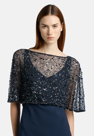 Temno modra bleščasta bluza s prosojnimi rokavi in V-izrezom, zasnovana z teksturirano površino in ohlapnim, elegantnim silhueto.