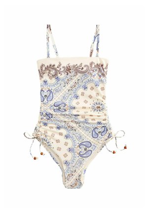 Costum de baie întreg cu bretele reglabile, legături laterale și bază crem cu modele florale paisley albastre și maro.