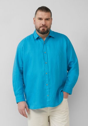 Türkise Hemdbluse mit langen Ärmeln, aus leichtem Stoff gefertigt. Verfügt über einen klassischen Kragen und beige Farben.