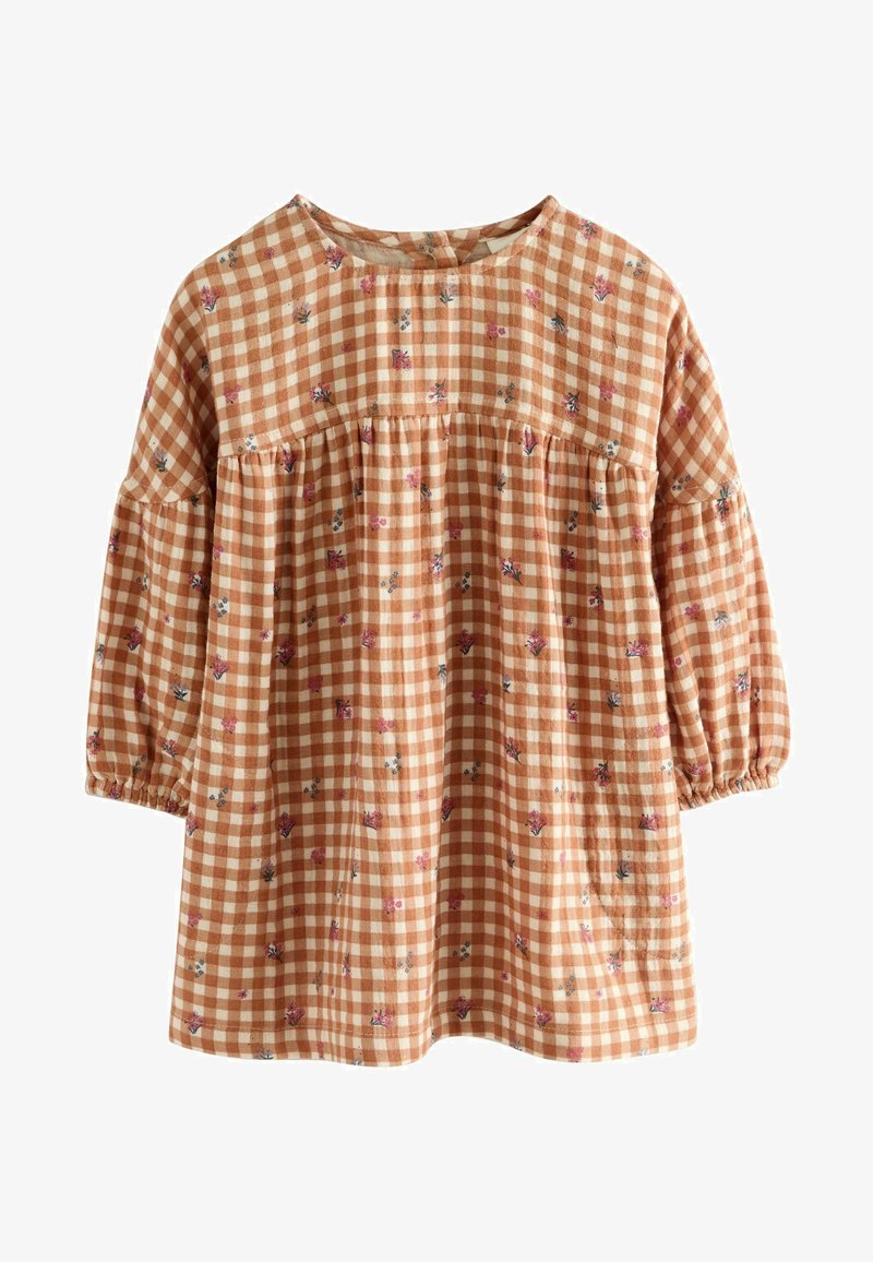 Ruskea ja kerma ruudullinen pusero, jossa on 3/4 puffihihat, kerrostettu vyötärö ja kukka-akcentit. Pehmeä kangas, jossa on teksturoitu pinta.